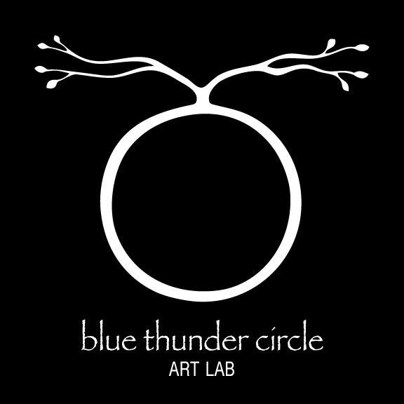 A logo for blue thunder circle art lab