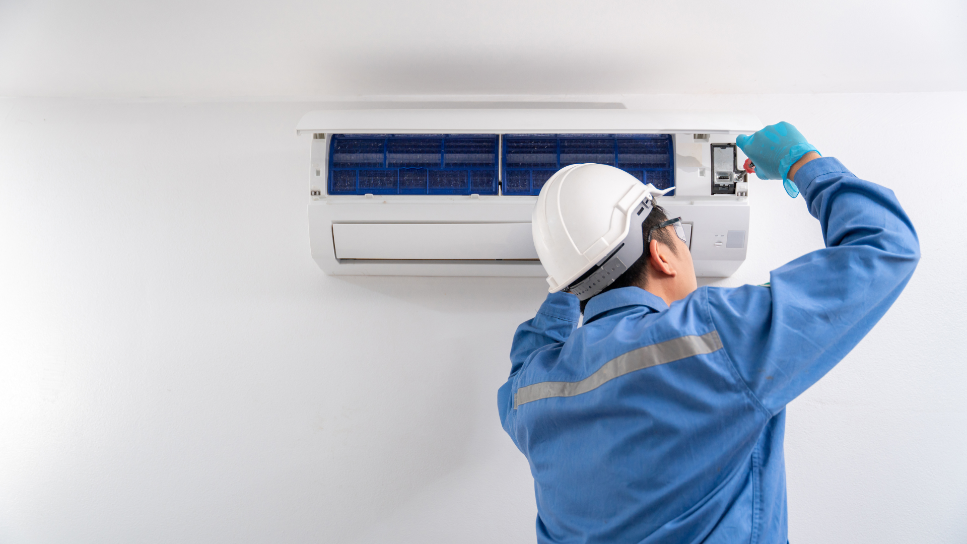 A conference room with a long table and chairs and a glass wall.