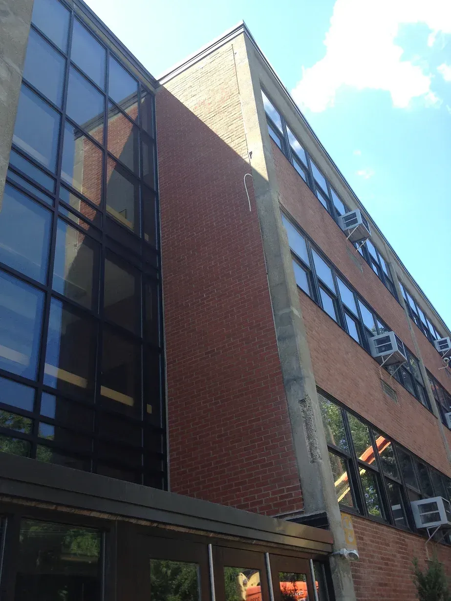 A large brick building with a lot of windows