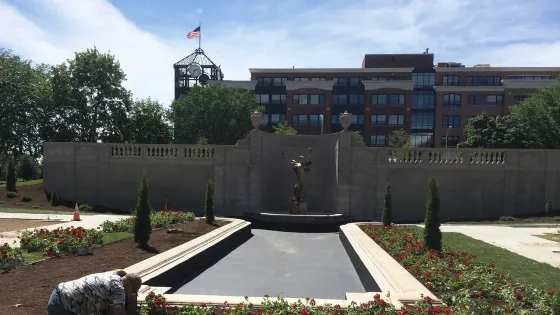 A large building with a fountain in front of it