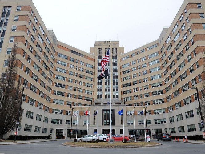 A large building with cars parked in front of it