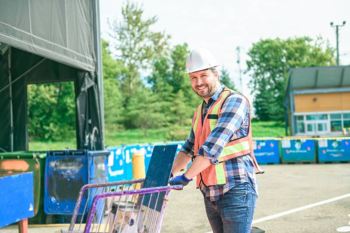 Battery recycling center worker in front of facility near Lexington, KY