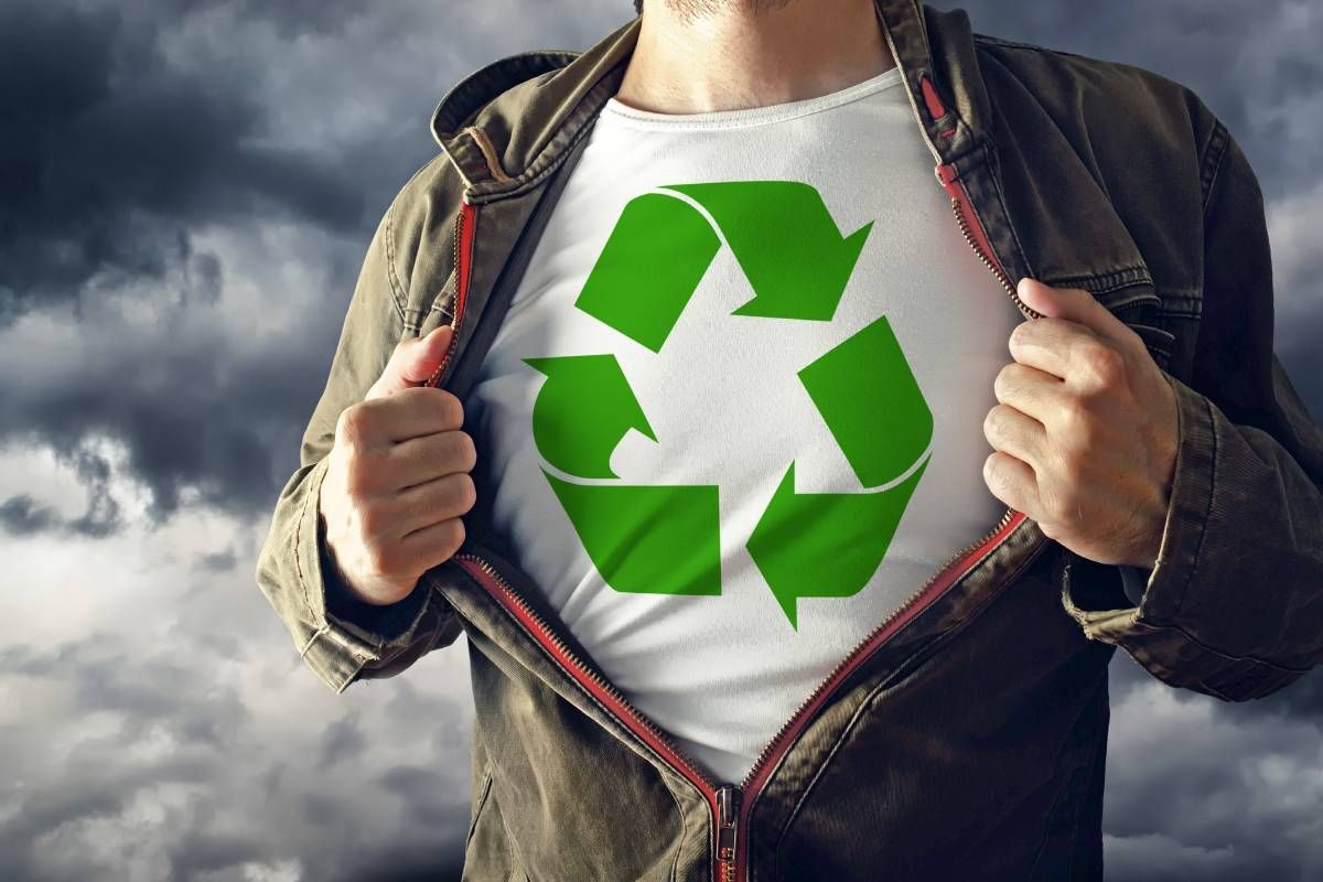 Man opening shirt to reveal shirt with recycling logo near Lexington, Kentucky (KY)