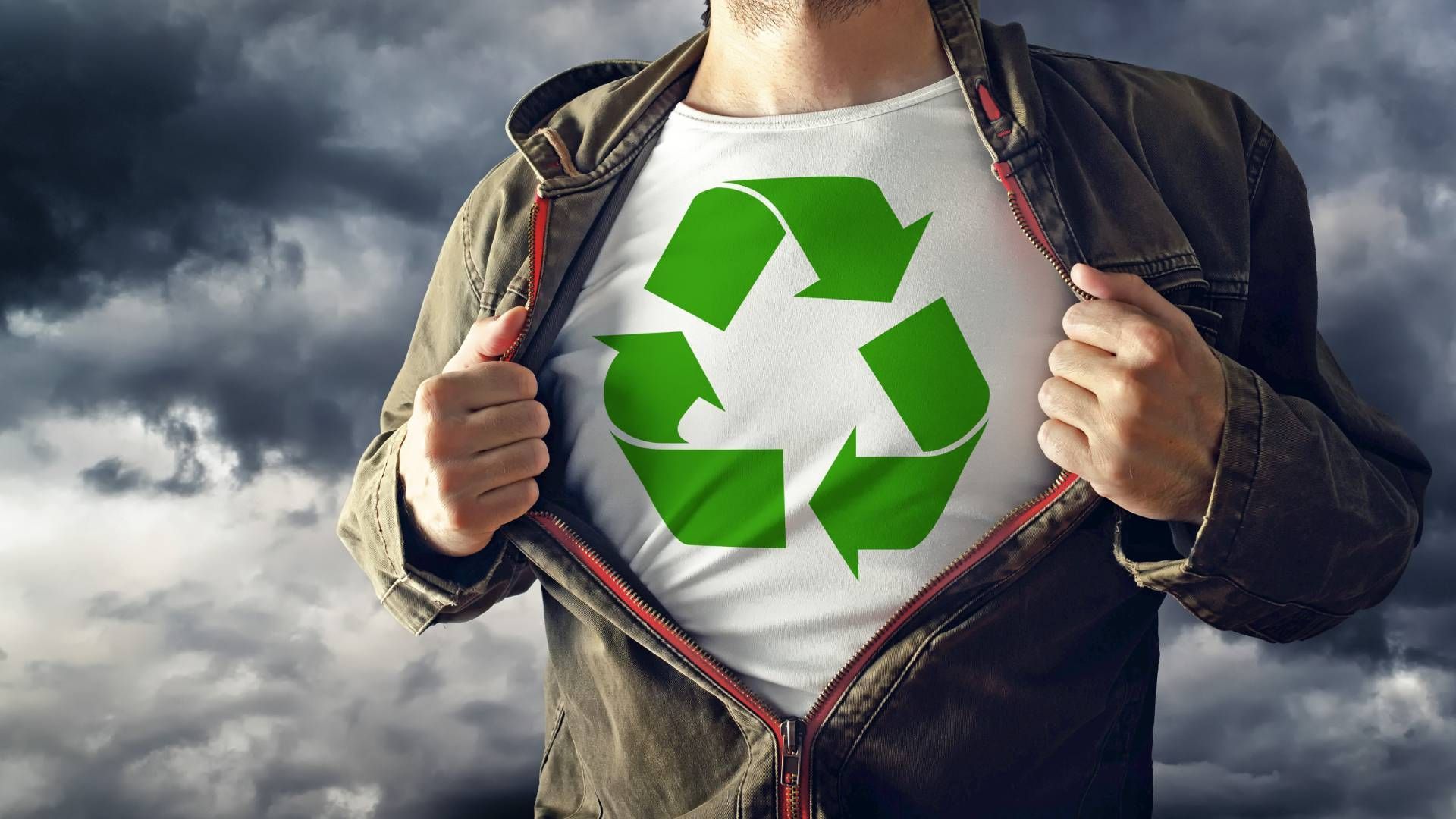 Man opening shirt to reveal shirt with recycling logo near Lexington, Kentucky (KY)