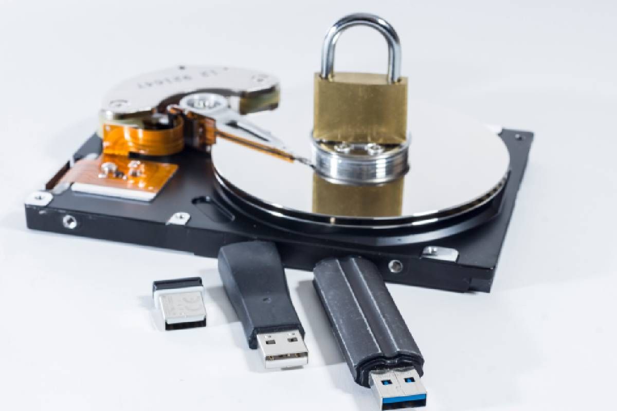 A lock with hard drives and USB sticks to represent secure IT asset disposal near Lexington, Kentucky (KY)
