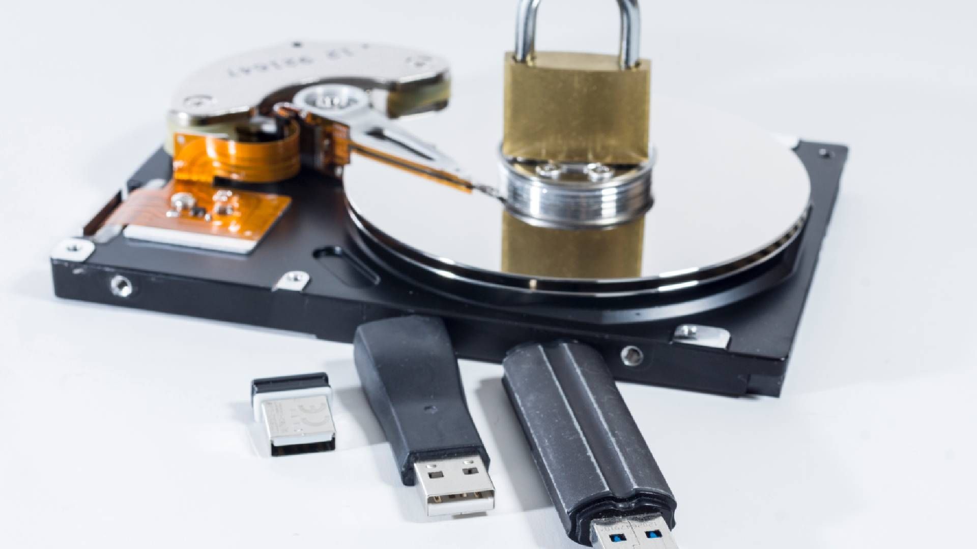 A lock with hard drives and USB sticks to represent secure IT asset disposal near Lexington, Kentuck