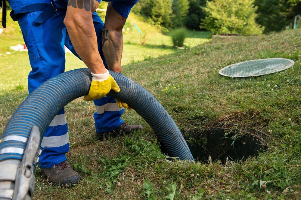 Person Emptying A Septic Tank