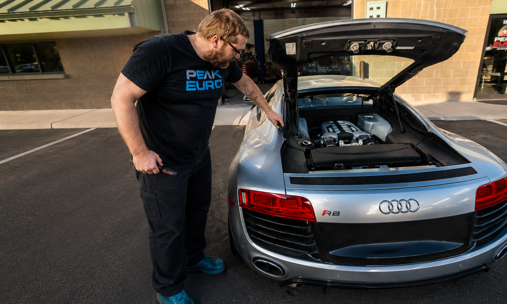 Peak Euro technician performing warranty-approved maintenance on an Audi R8 in Bend Oregon