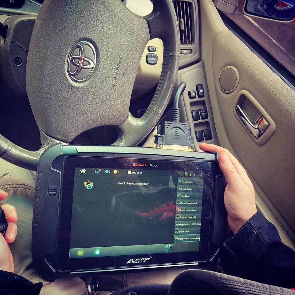 A Person Is Using a Tablet in A Car — Toowoomba Locksmiths in Warwick, QLD