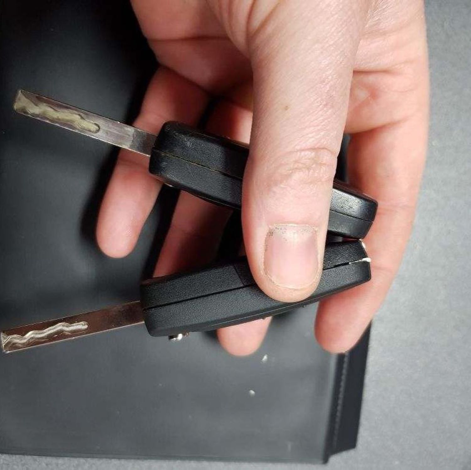 A Person Is Holding Keys — Toowoomba Locksmiths in Lockyer Valley, QLD