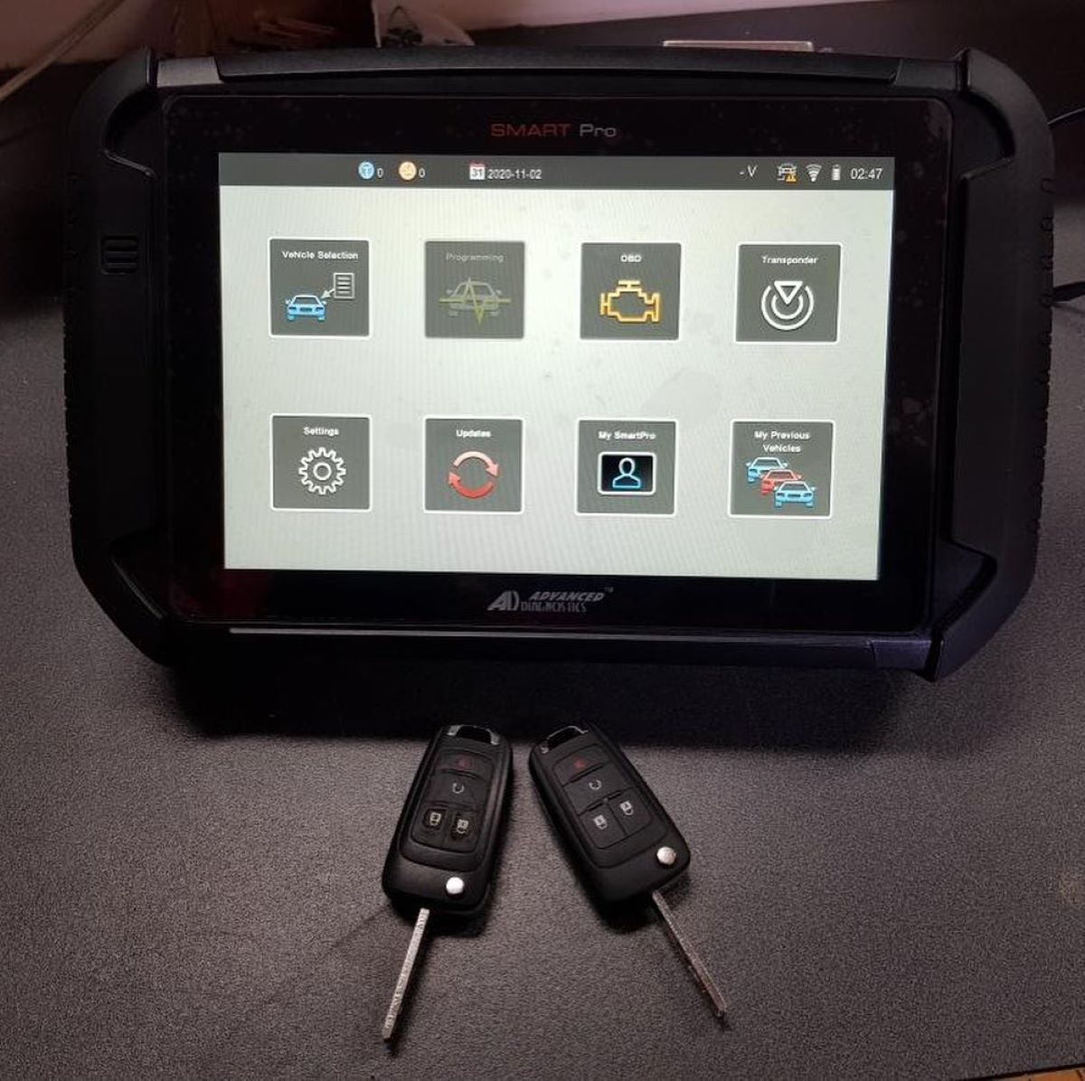 Two Car Keys Are Sitting on A Table — Toowoomba Locksmiths in Gatton, QLD