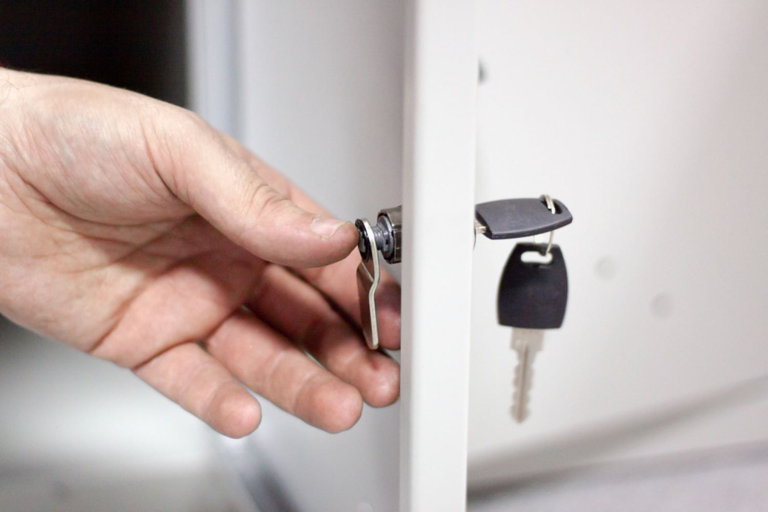 A Person Is Opening a Locker — Toowoomba Locksmiths in Highfields, QLD
