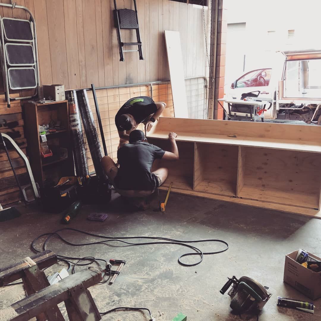 Two Men Are Working in A Garage — Toowoomba Locksmiths in Highfields, QLD