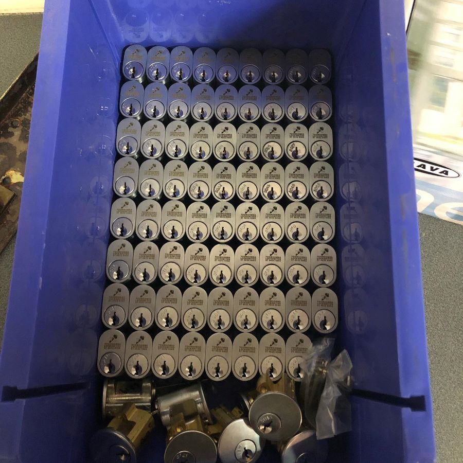 A Blue Container Filled with Lots of Locks and Keys — Toowoomba Locksmiths in Highfields, QLD