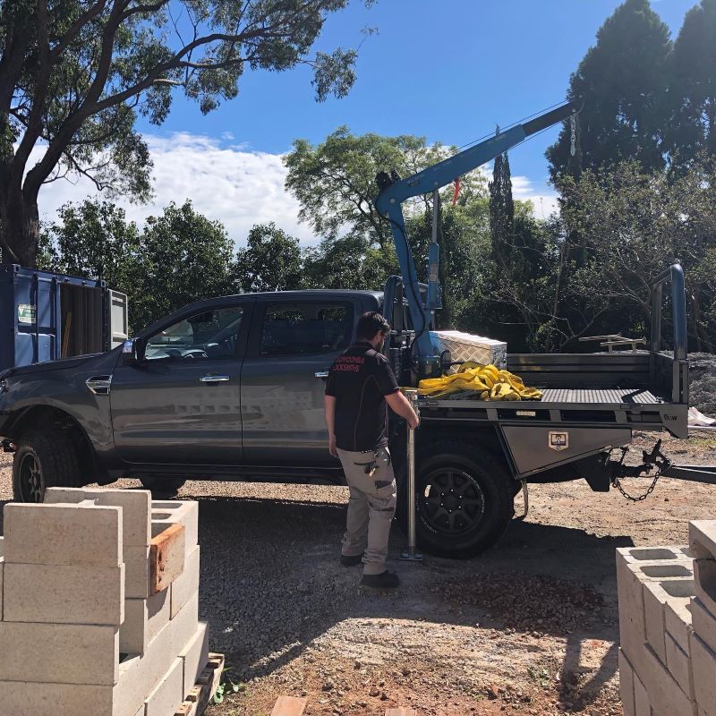 A Man Standing Next to A Truck — Toowoomba Locksmiths in Lockyer Valley, QLD