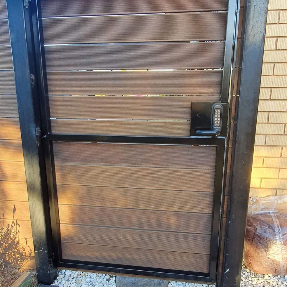 A Wooden Gate with A Black Frame — Toowoomba Locksmiths in Dalby, QLD