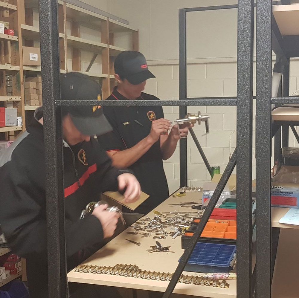 A Man Is Working with Keys — Toowoomba Locksmiths in Toowoomba City, QLD