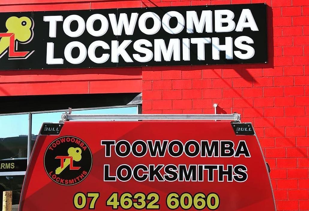 A Van Is Parked in Front of A Red Brick Building — Toowoomba Locksmiths in Toowoomba City, QLD