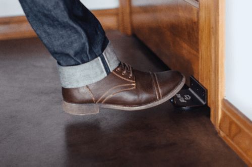 Person Wearing Brown Shoes Is Standing on A Wooden Floor — Toowoomba Locksmiths in Toowoomba City, QLD