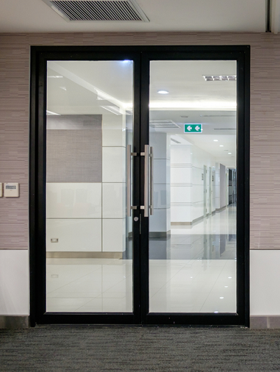 A Glass Door with A Black Frame — Toowoomba Locksmiths in Toowoomba City, QLD