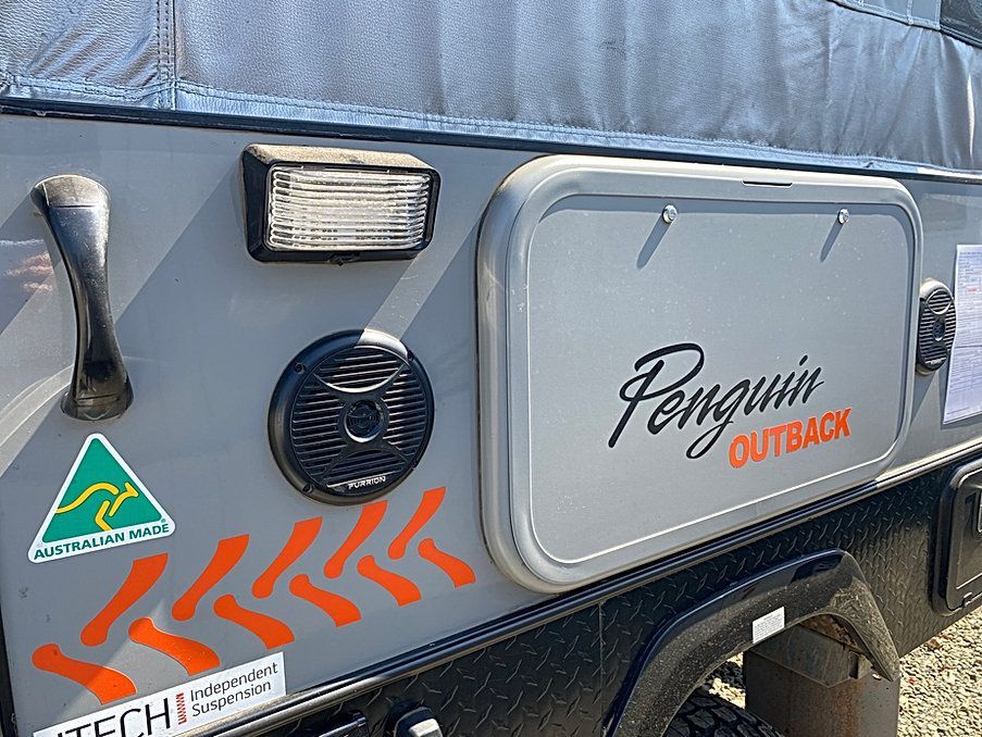 A Penguin Outback Trailer Is Parked In A Gravel Lot — Great Lakes Caravans In Nabiac, NSW