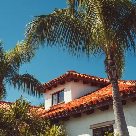 Professional Tampa roofing crews sealing roof penetrations and flashing around chimneys and skylights.