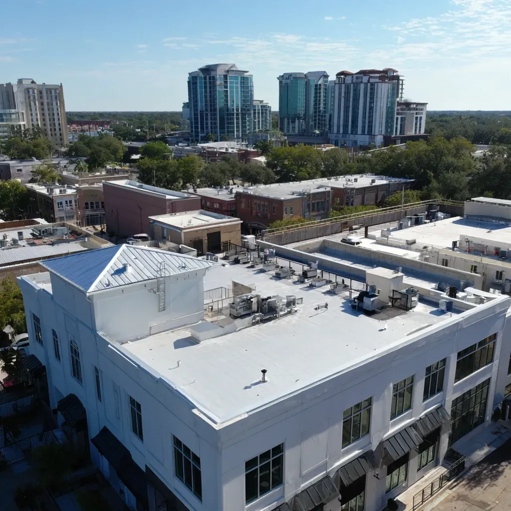 Commercial flat roof installation in Tampa FL with reflective white membranes to reduce cooling costs.