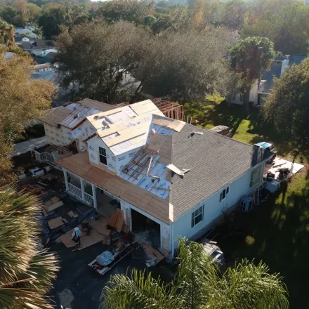 Local Tampa roofing pros completing insurance-covered roof replacements for hurricane damage.