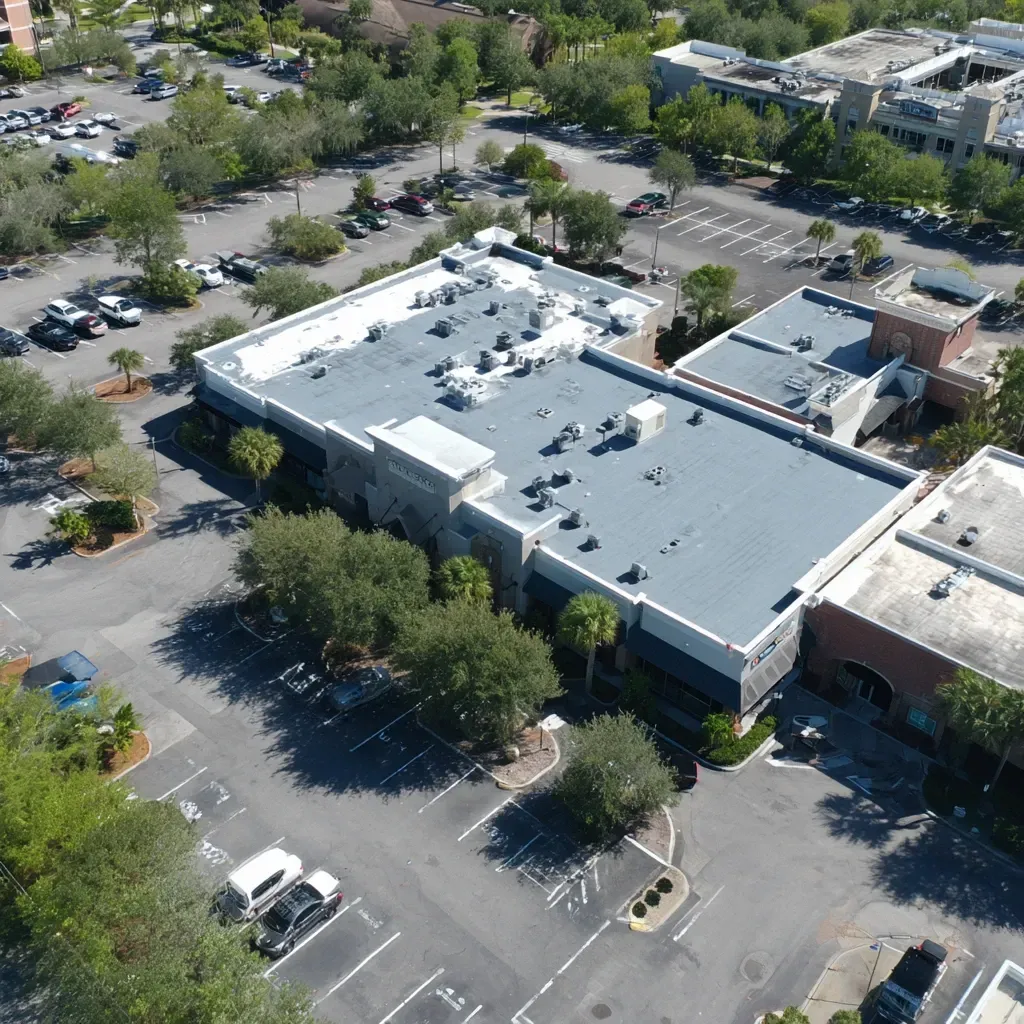Flat roof professionals performing commercial reflective roofing installation with quick turnaround.
