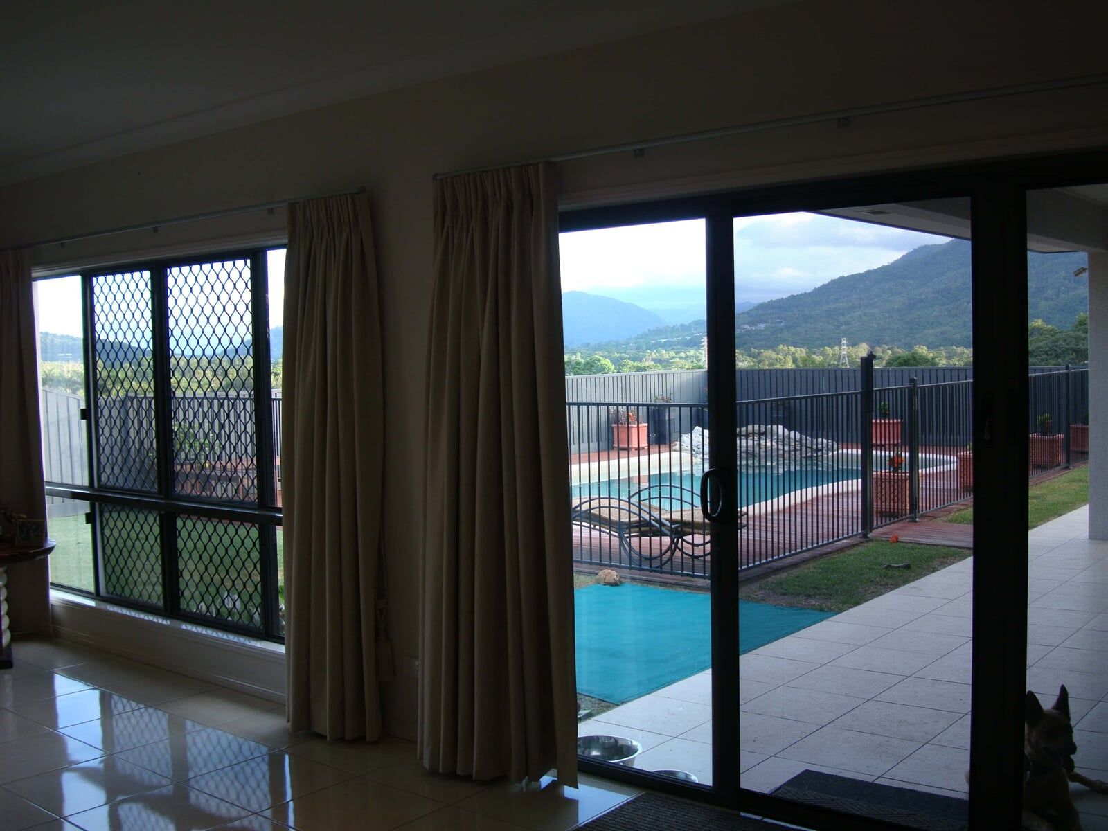 Sliding Glass Door With Curtain - Security Fitters in Cairns, QLD