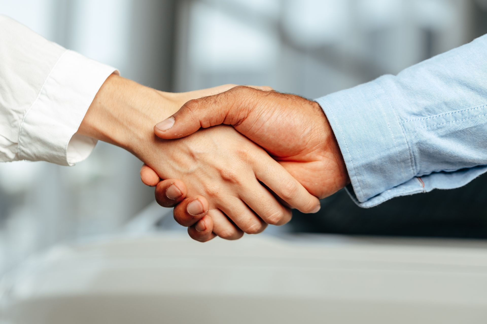 Two people shaking hands, a business agreement.