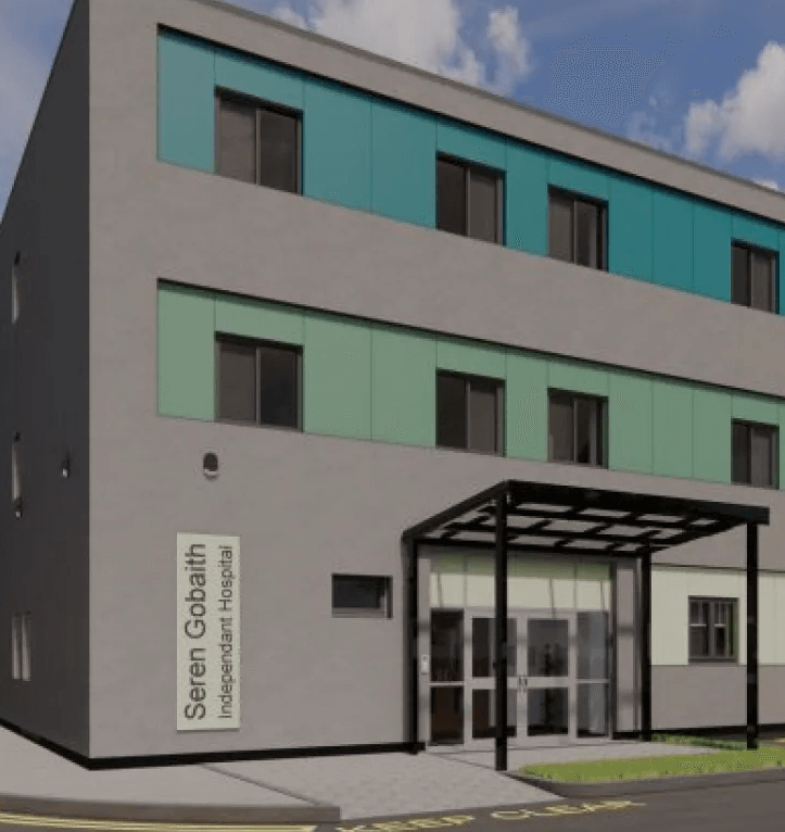 Seren Gobiaith Independent Hospital exterior. Modern building with teal and green panels.