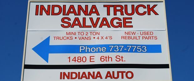 A sign that says indiana truck salvage on it