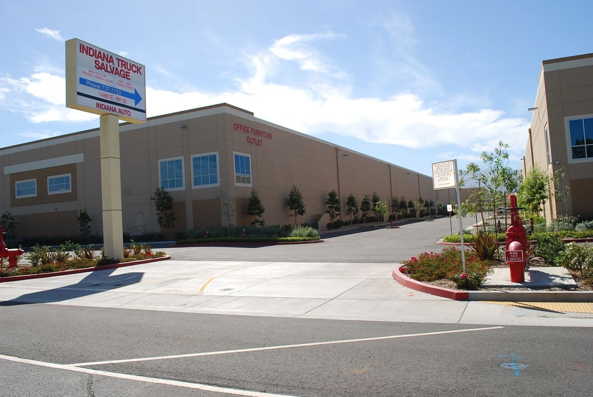 A large building with a sign that says ' moving office ' on it