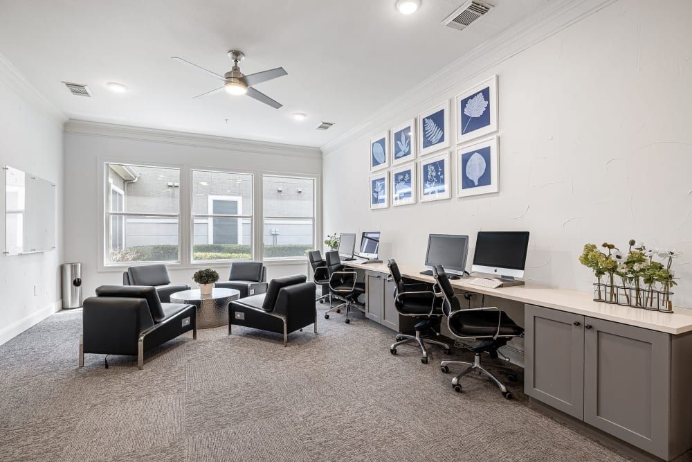 Business center with a lot of furniture and computers at Marquis at The Cascades in Tyler, TX.