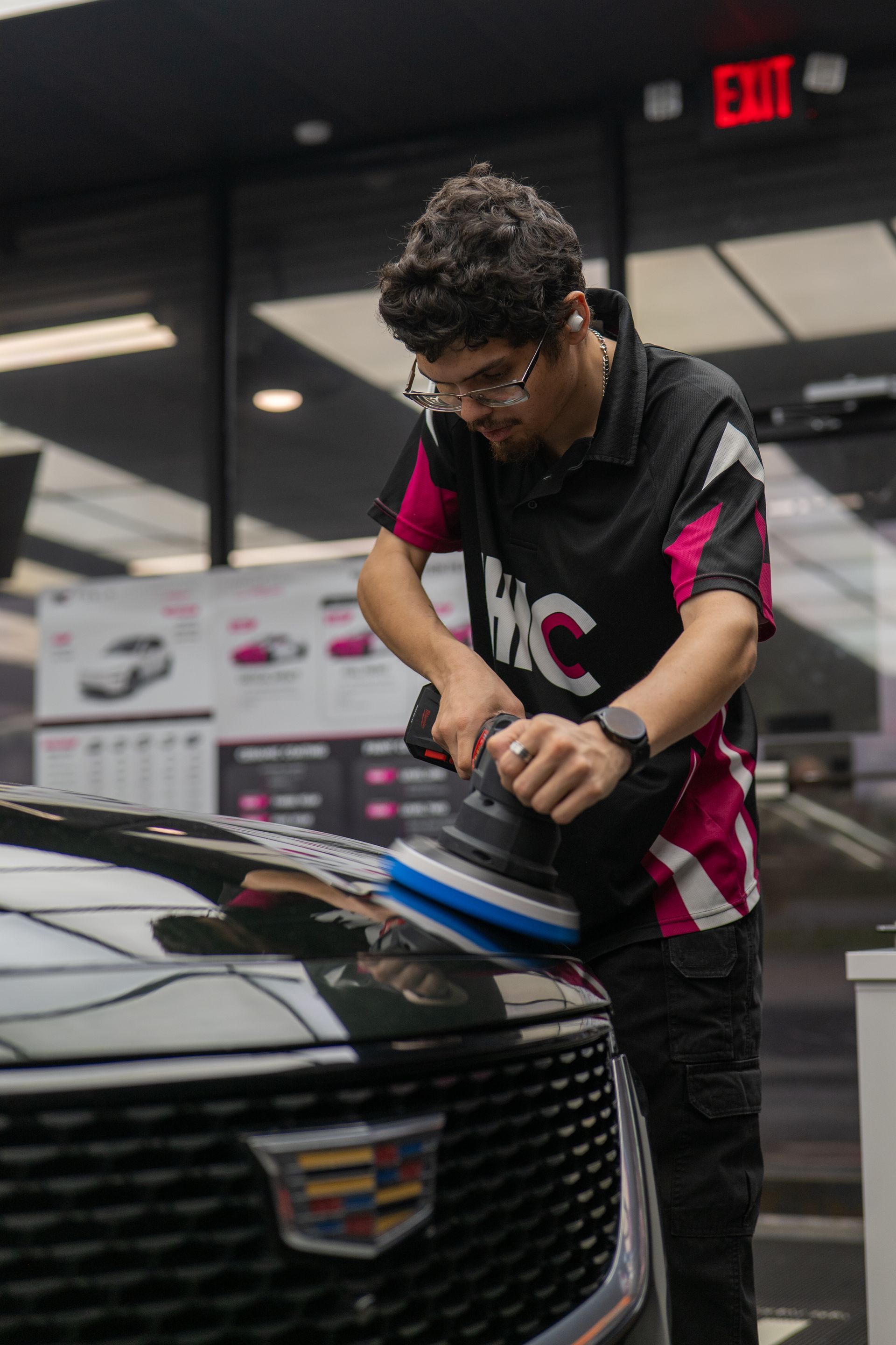 Professional paint correction on a Cadillac CT5 hood using a Milwaukee polisher and Sonax Cut and Finish compound near Killeen TX