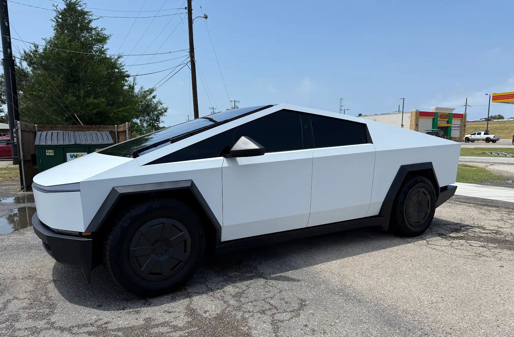 A Tesla Cybertruck completed in color change PPF satin white