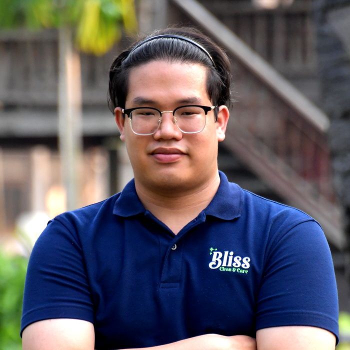 A woman wearing a blue shirt that says bliss