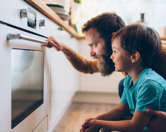 Father and Son Cooking Dinner — Jacksonville, FL — Appliance Doctors