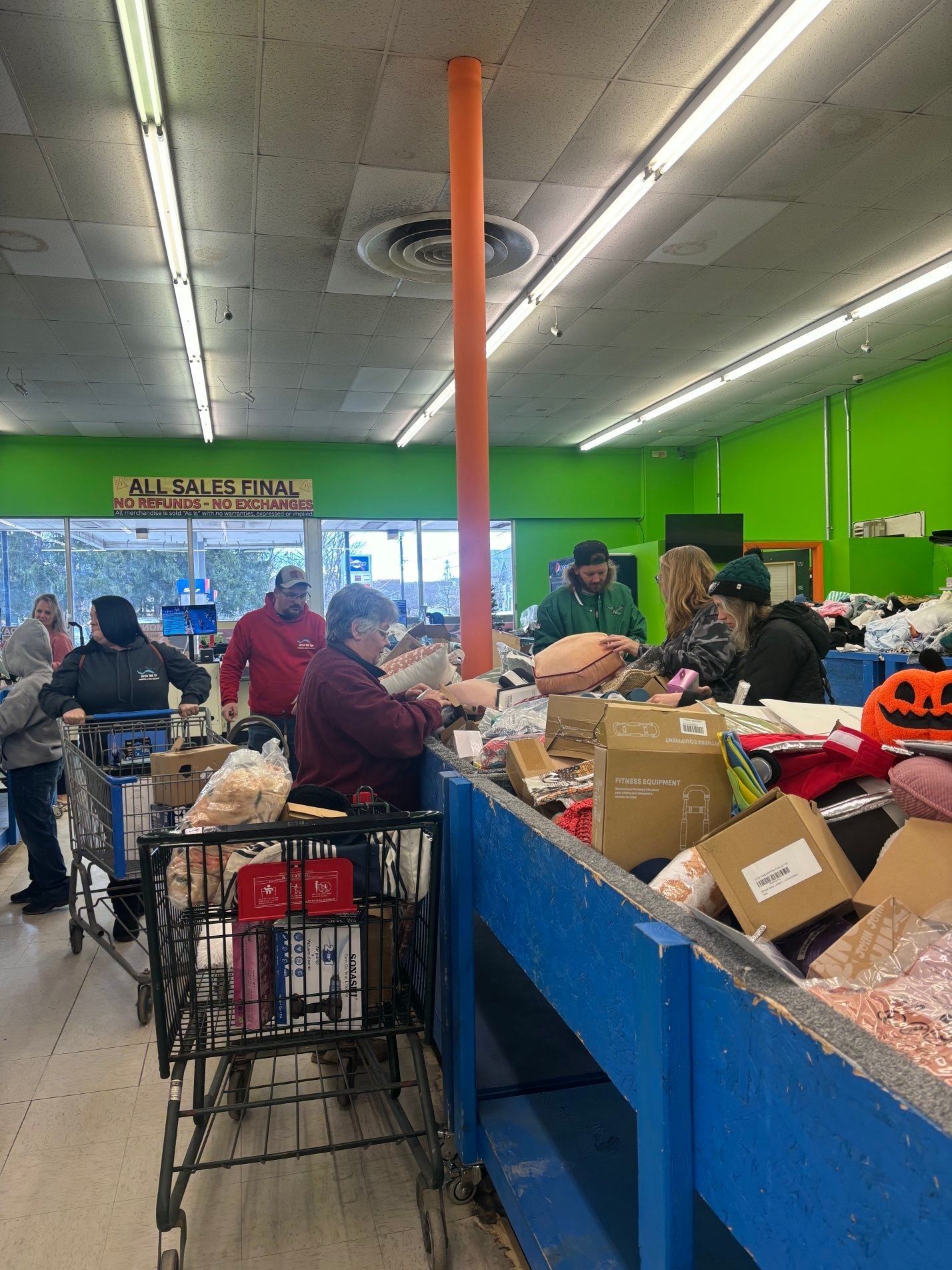 A warehouse filled with lots of wooden pallets and boxes.