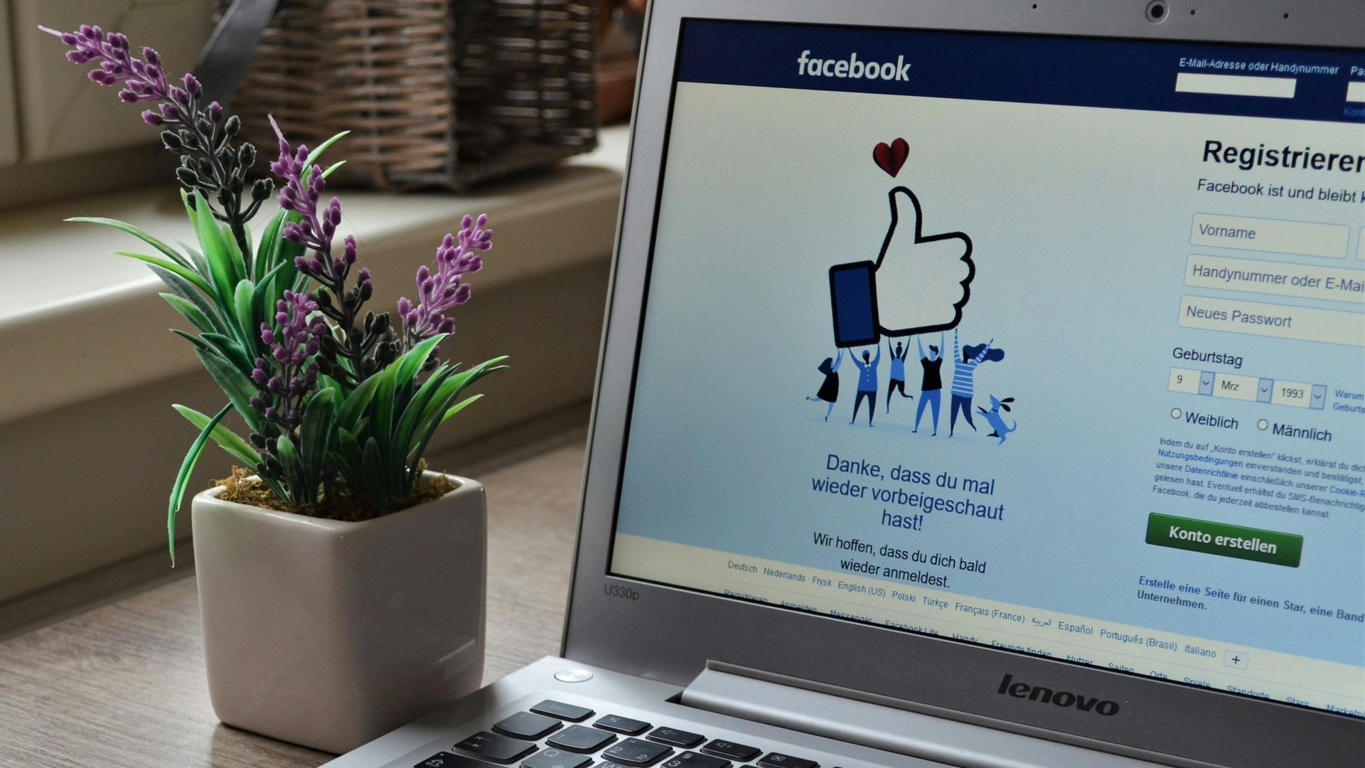 A laptop computer is open to a Facebook page