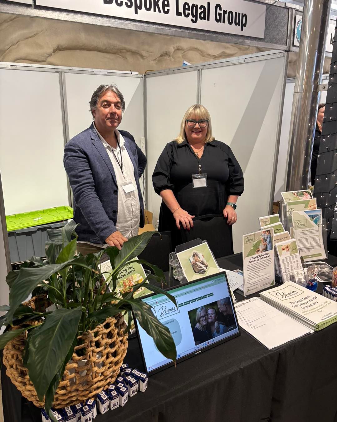 People Walking Through an Exhibition Hall with Tables — Bespoke Legal Group In Southport, QLD
