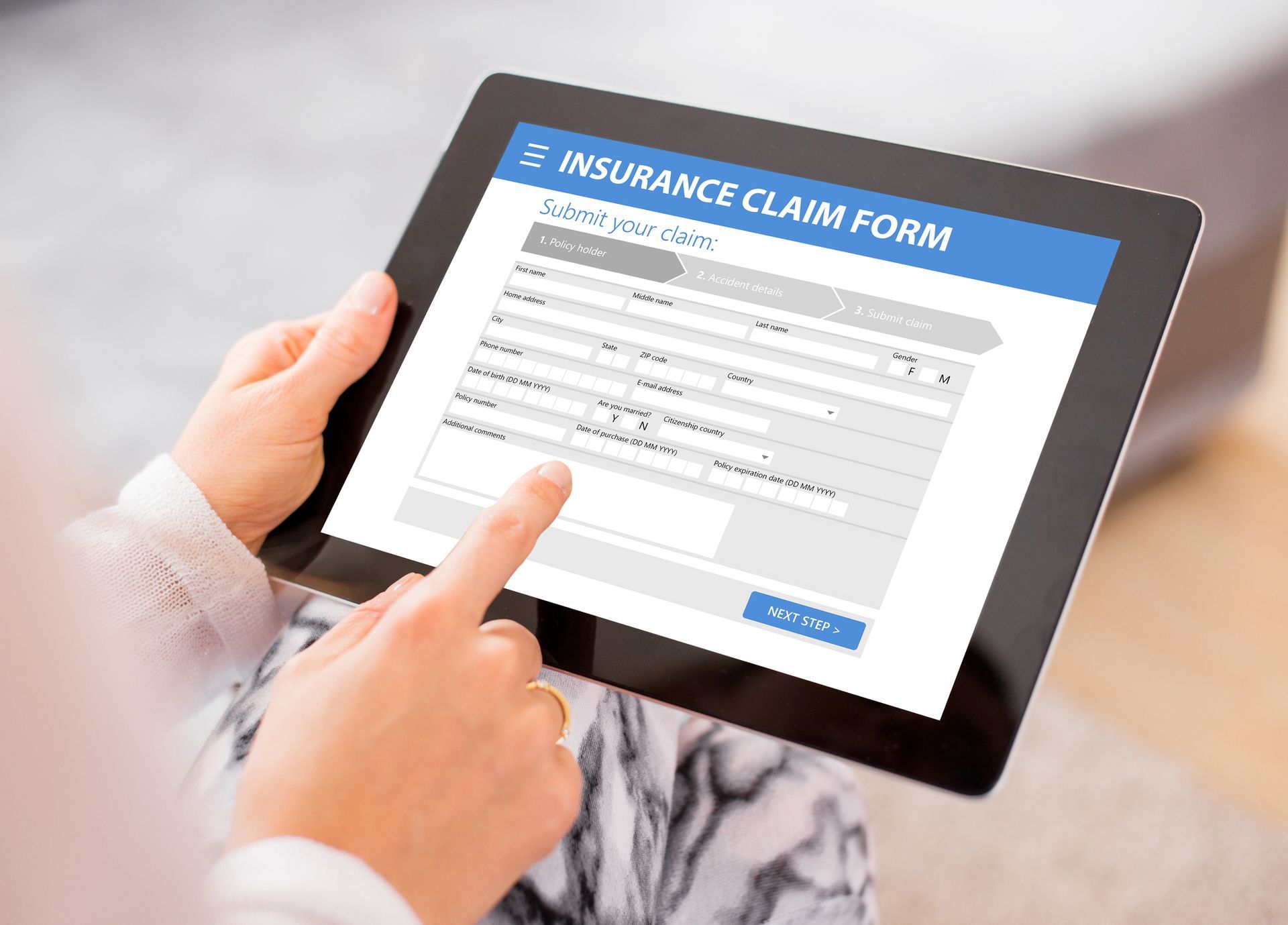 Person Using Tablet to Fill Out an Insurance Claim Form — Bespoke Legal Group In Northern, NSW