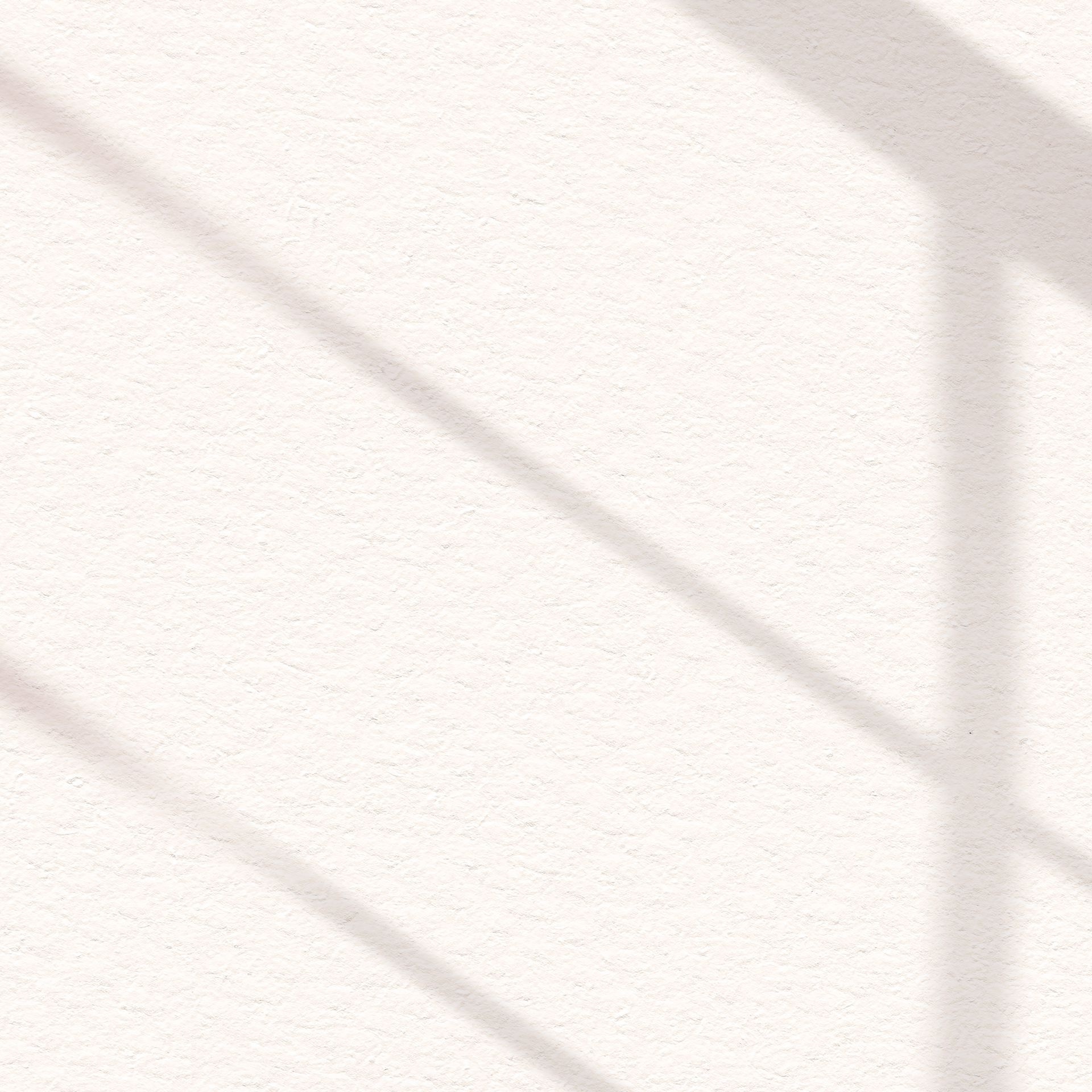 A shadow of a window on a white wall.