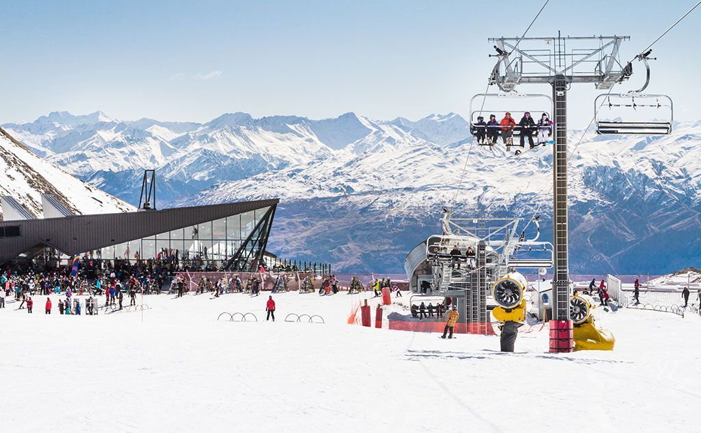 Skiers and snowboarders enjoying a thrilling day on the slopes of Remarkables Ski Field