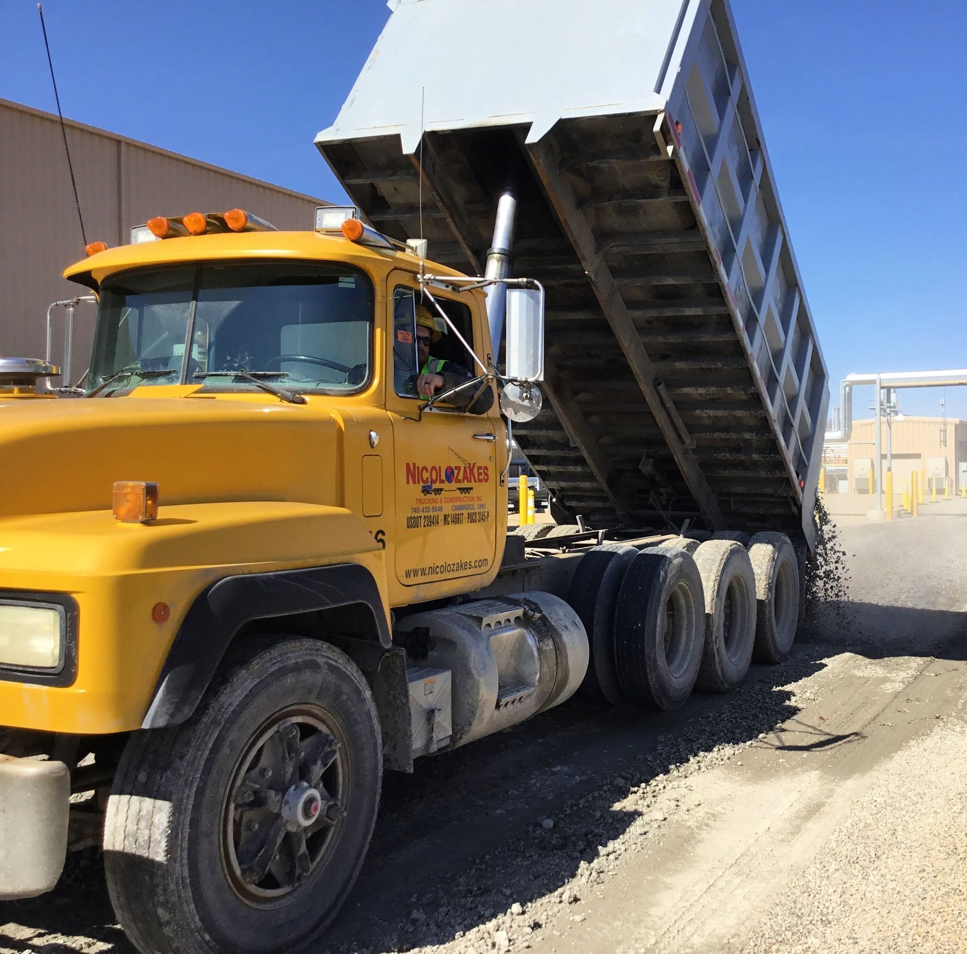 A pile of rubble on top of a building with a white background.