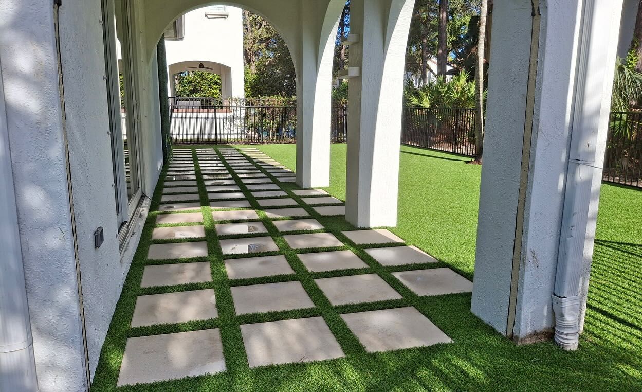 A walkway with a lot of square tiles on it