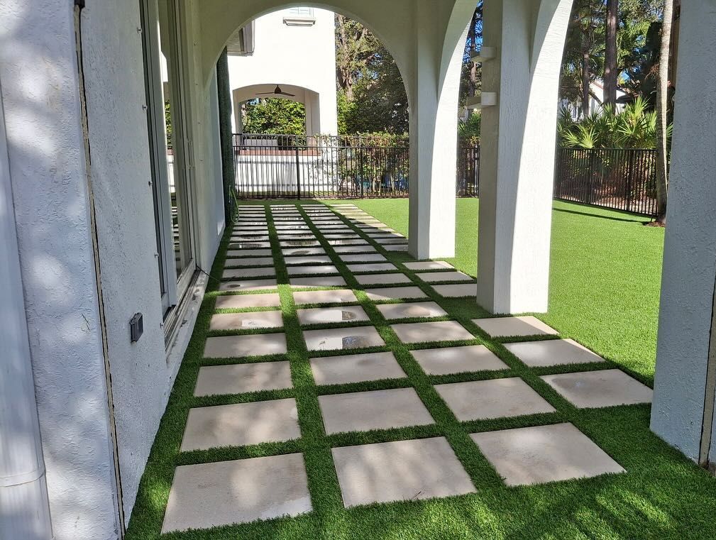 A walkway with a lot of square tiles on it