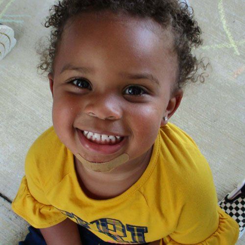 2 Year Old on Yellow Shirt Smiling — Tyler, TX — Stepping Stone School