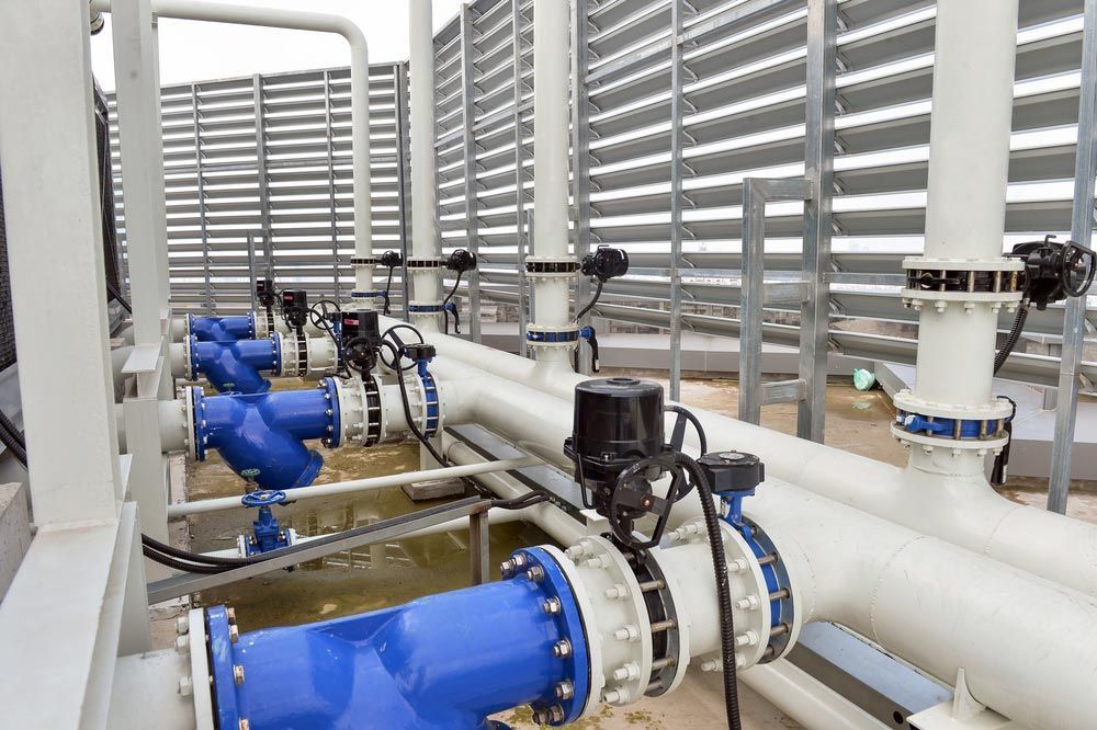 Blue Pipes, Valves, and Mechanical Components on a Rooftop — Keyeng in Slade Point, QLD